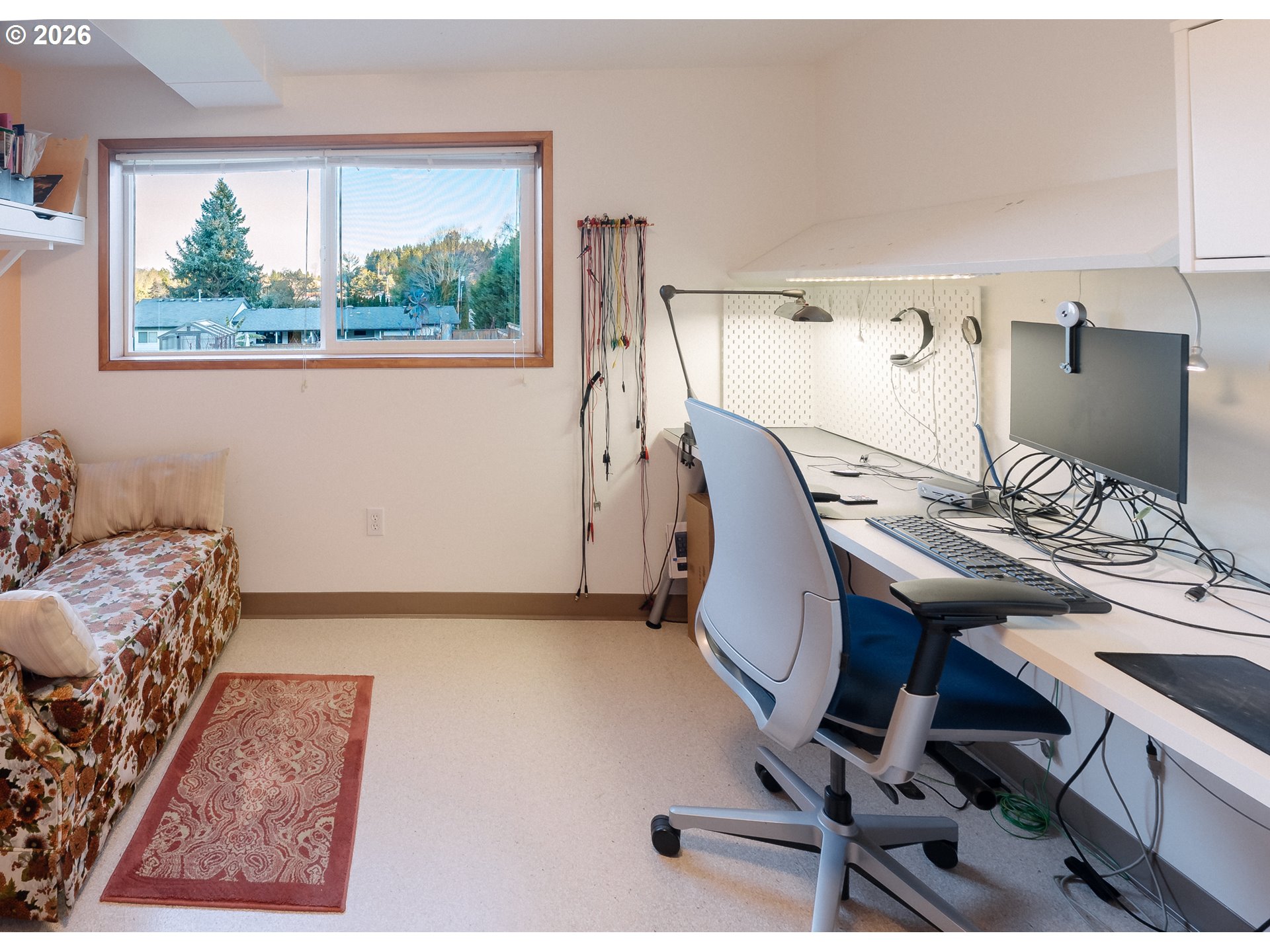 14285 Southwest 114th Avenue Tigard, OR 97224 - Photo 24 of 42 a view of a workspace with furniture and a window