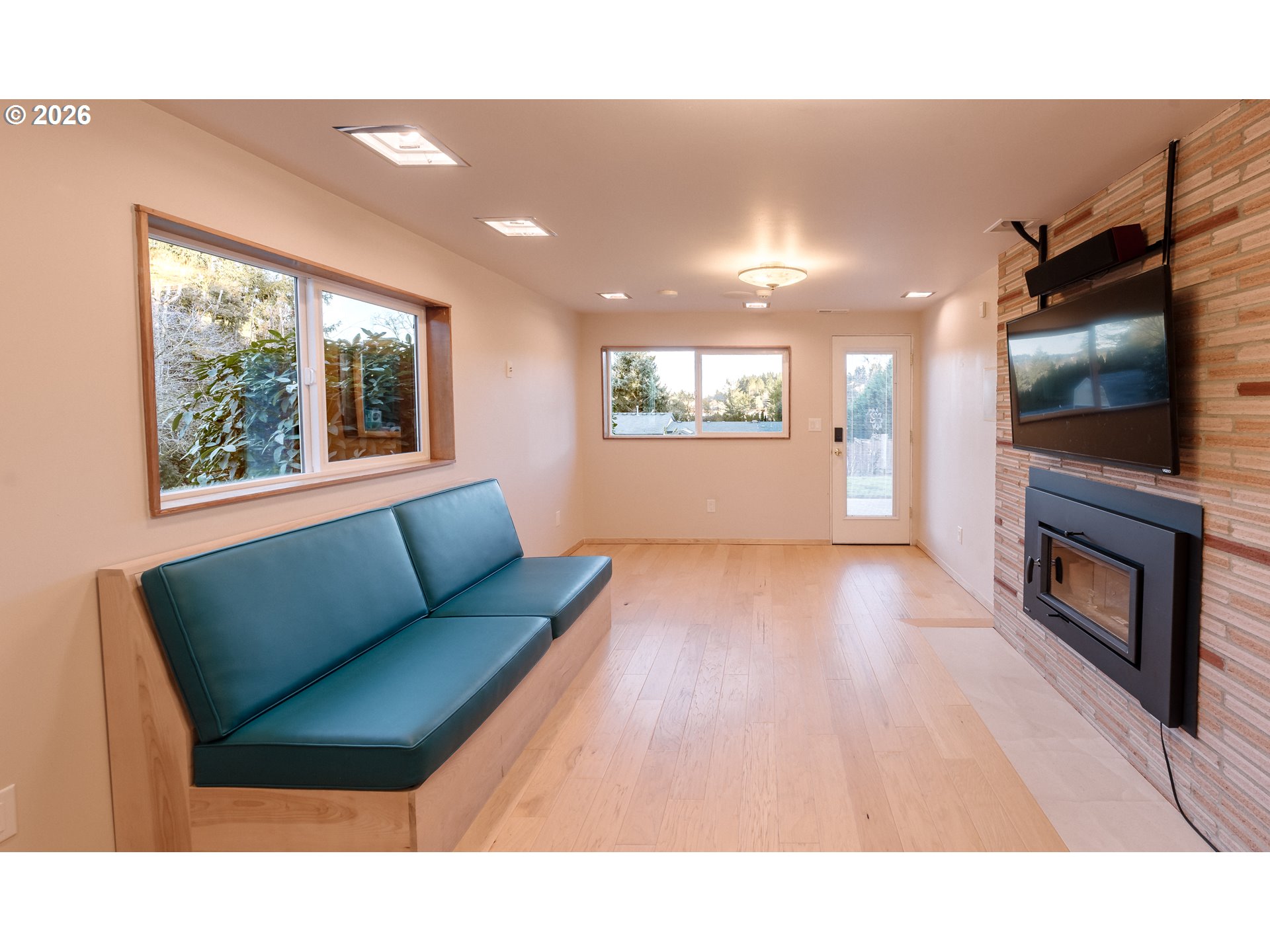 14285 Southwest 114th Avenue Tigard, OR 97224 - Photo 25 of 42 a living room with furniture and a flat screen tv
