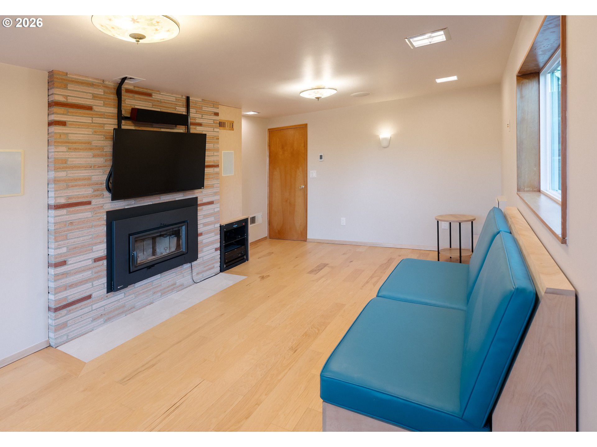 14285 Southwest 114th Avenue Tigard, OR 97224 - Photo 26 of 42 a living room with fireplace furniture and a flat screen tv