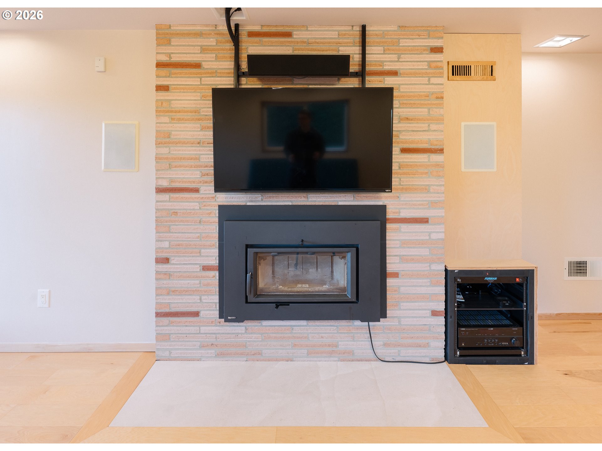 14285 Southwest 114th Avenue Tigard, OR 97224 - Photo 27 of 42 a living room with a fireplace and a table