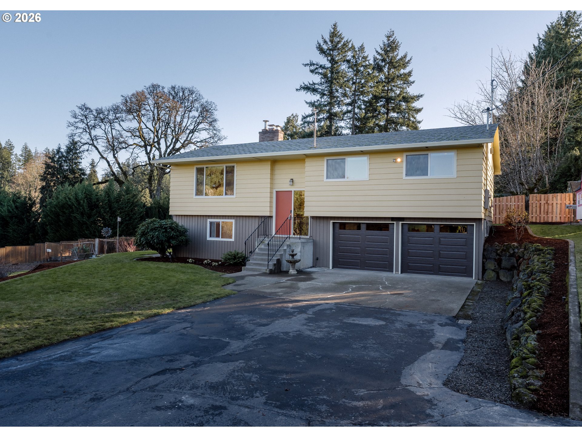 14285 Southwest 114th Avenue Tigard, OR 97224 - Photo 39 of 42 a front view of a house with a yard and garage