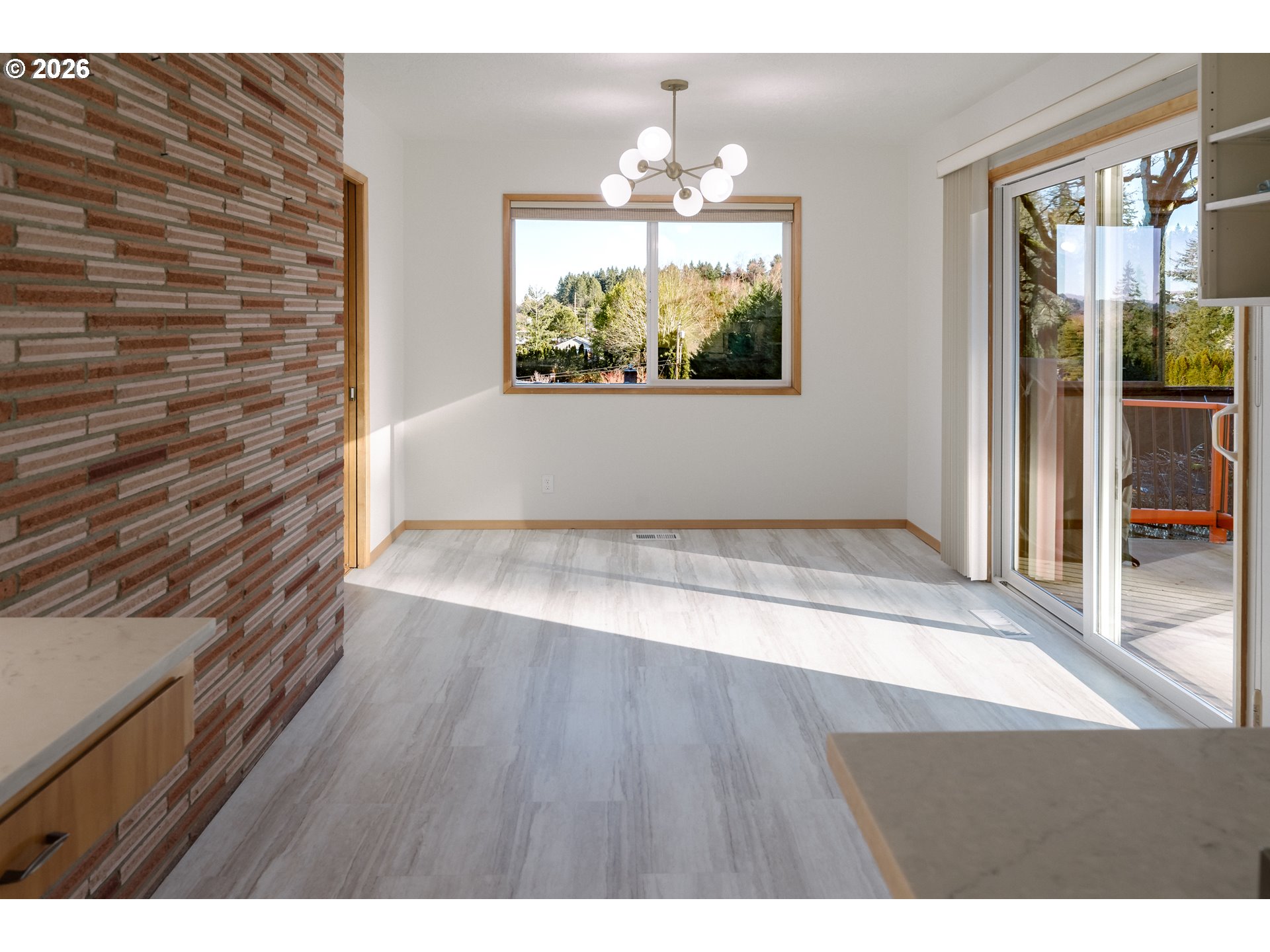 14285 Southwest 114th Avenue Tigard, OR 97224 - Photo 10 of 42 a view of empty room with wooden floor and fan