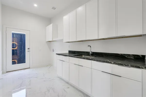 a view of kitchen with furniture and wooden floor