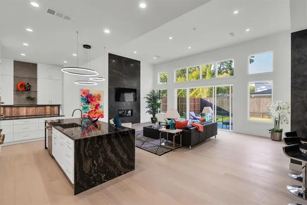 a bathroom with a bathtub sink and mirror