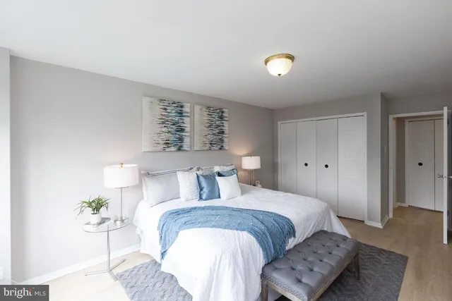 a bedroom with a bed and a couch