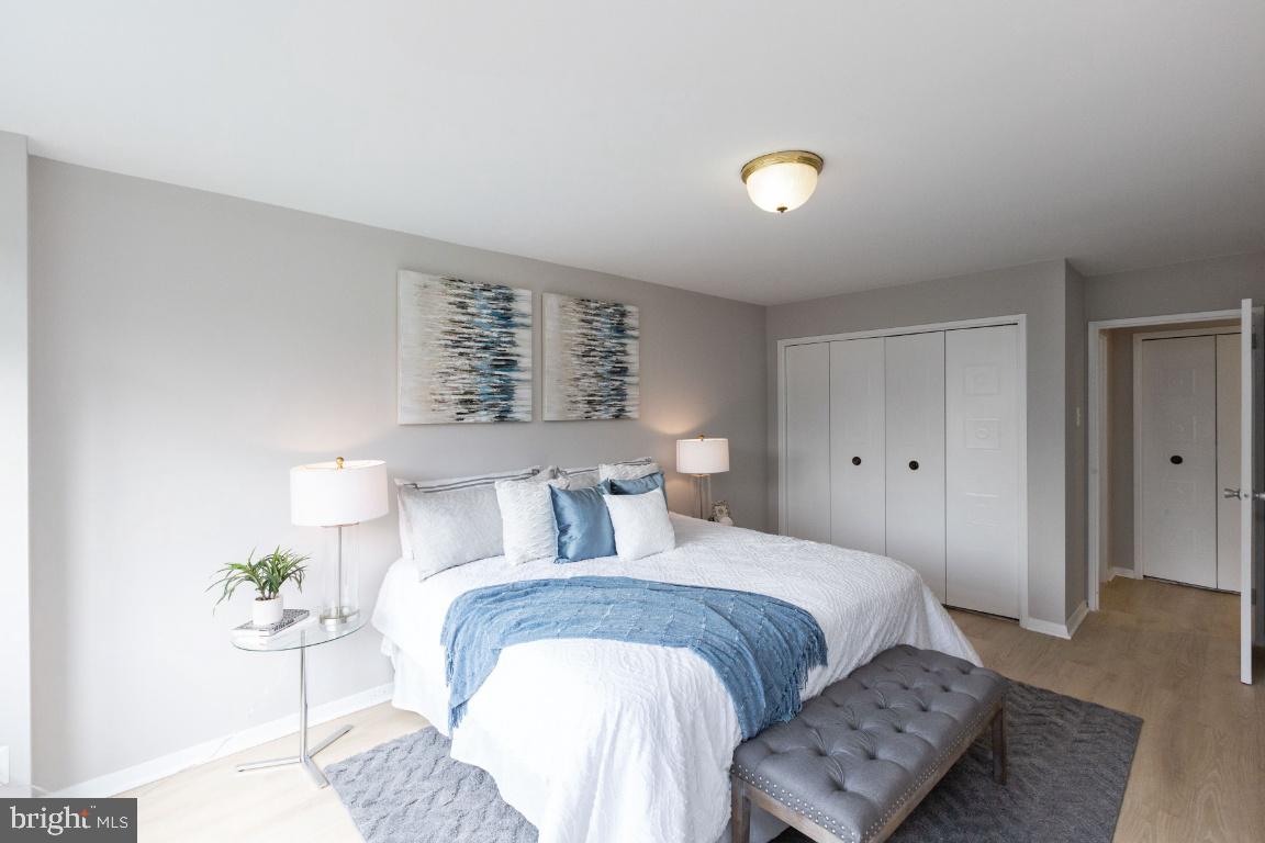 1900 Lyttonsville Road, Unit 714 Silver Spring, MD 20910 - Photo 12 of 22 a bedroom with a bed and a couch