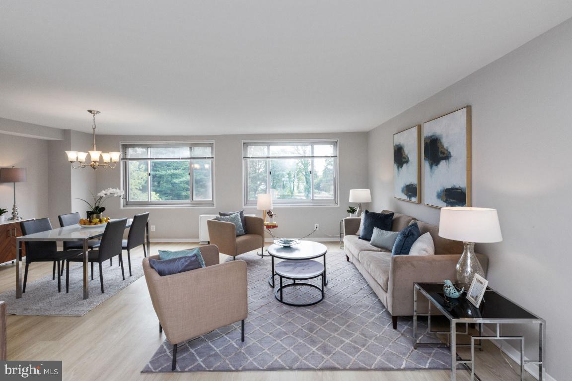 1900 Lyttonsville Road, Unit 714 Silver Spring, MD 20910 - Photo 3 of 22 a living room with furniture and a large window