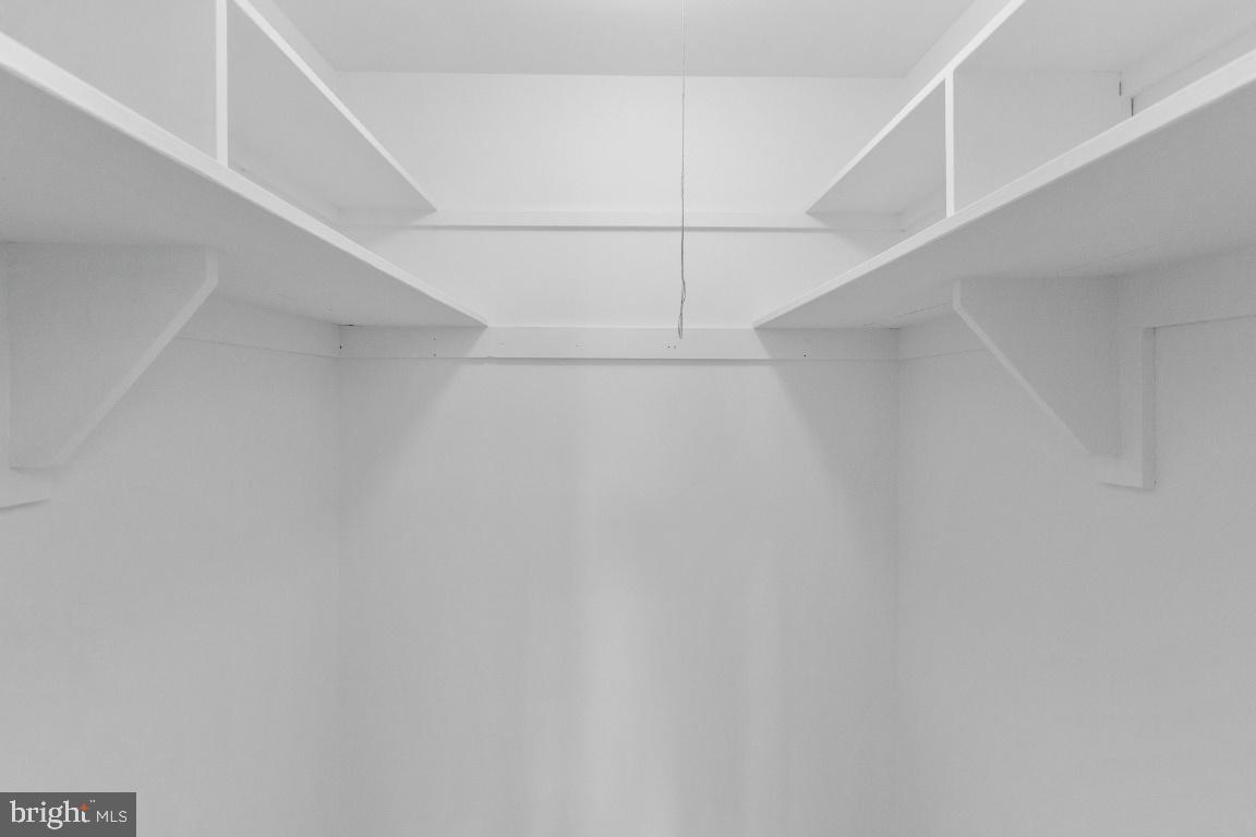 1900 Lyttonsville Road, Unit 714 Silver Spring, MD 20910 - Photo 8 of 22 a view of an empty walk in closet