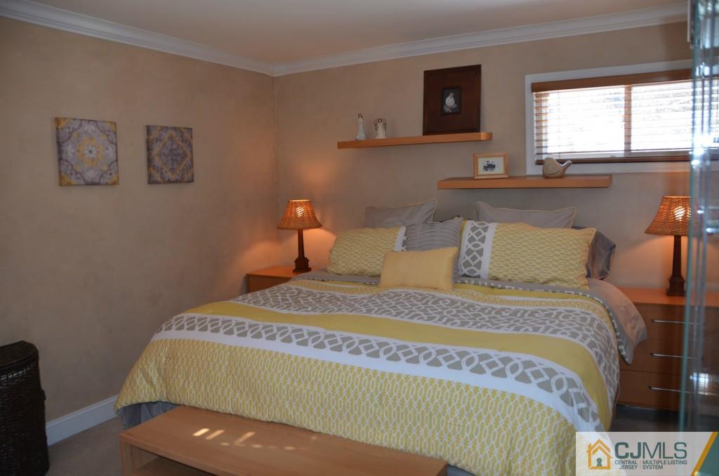 36 Tunison Road New Brunswick, NJ 08901 - Photo 14 of 19 a bedroom with a bed and window