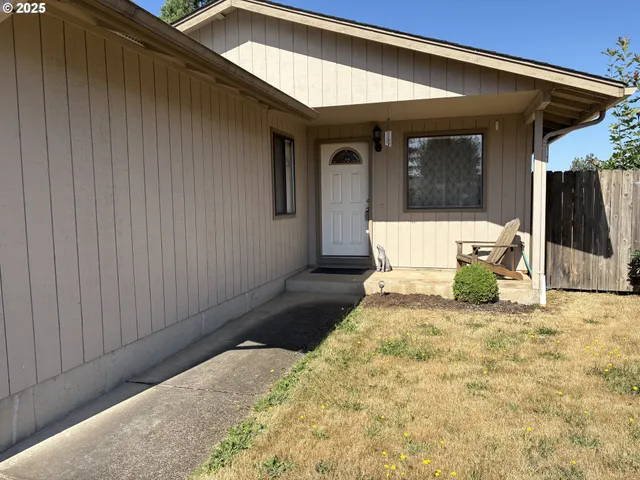 a view of a house with large windows