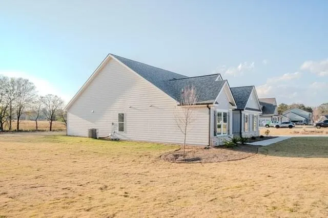 a view of a house with a snow in the yard