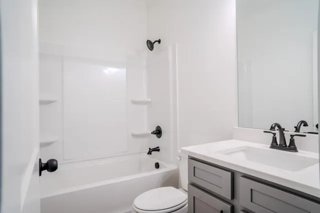 a bathroom with a sink toilet a shower and bathtub