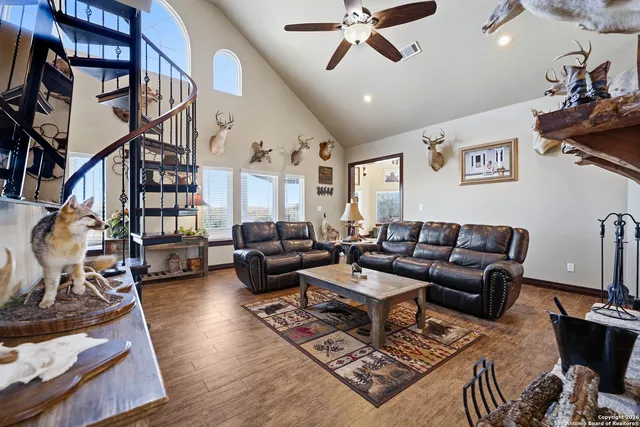 a living room with furniture or couch and a bookshelf