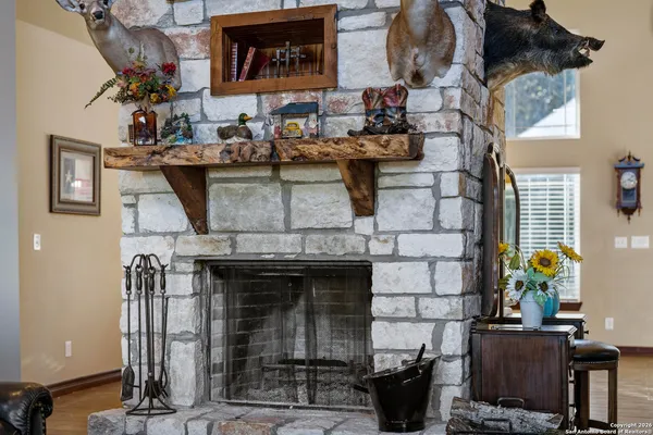 a picture of a living room with a fireplace