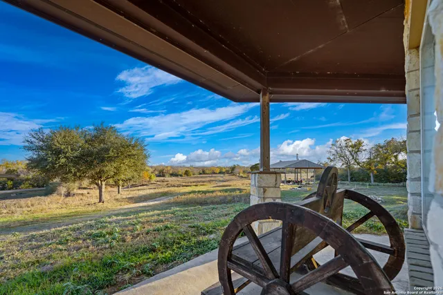 a view of a chairs and table in the patio