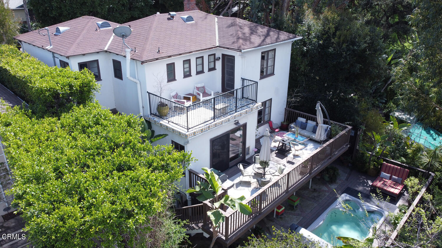 an aerial view of a house with a garden