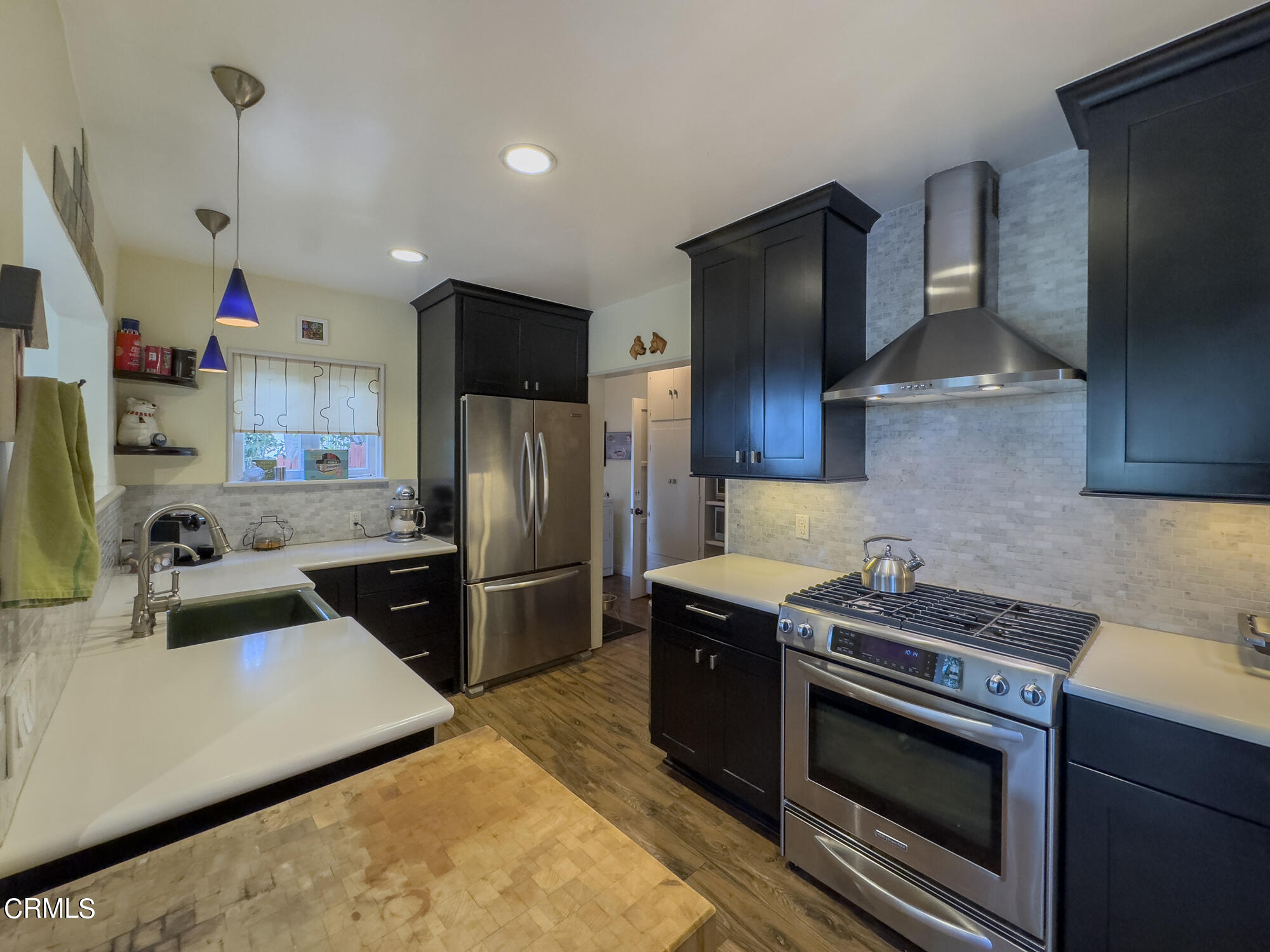 735 Prospect Drive Glendale, CA 91205 - Photo 12 of 49 a kitchen with stainless steel appliances granite countertop a sink stove and refrigerator