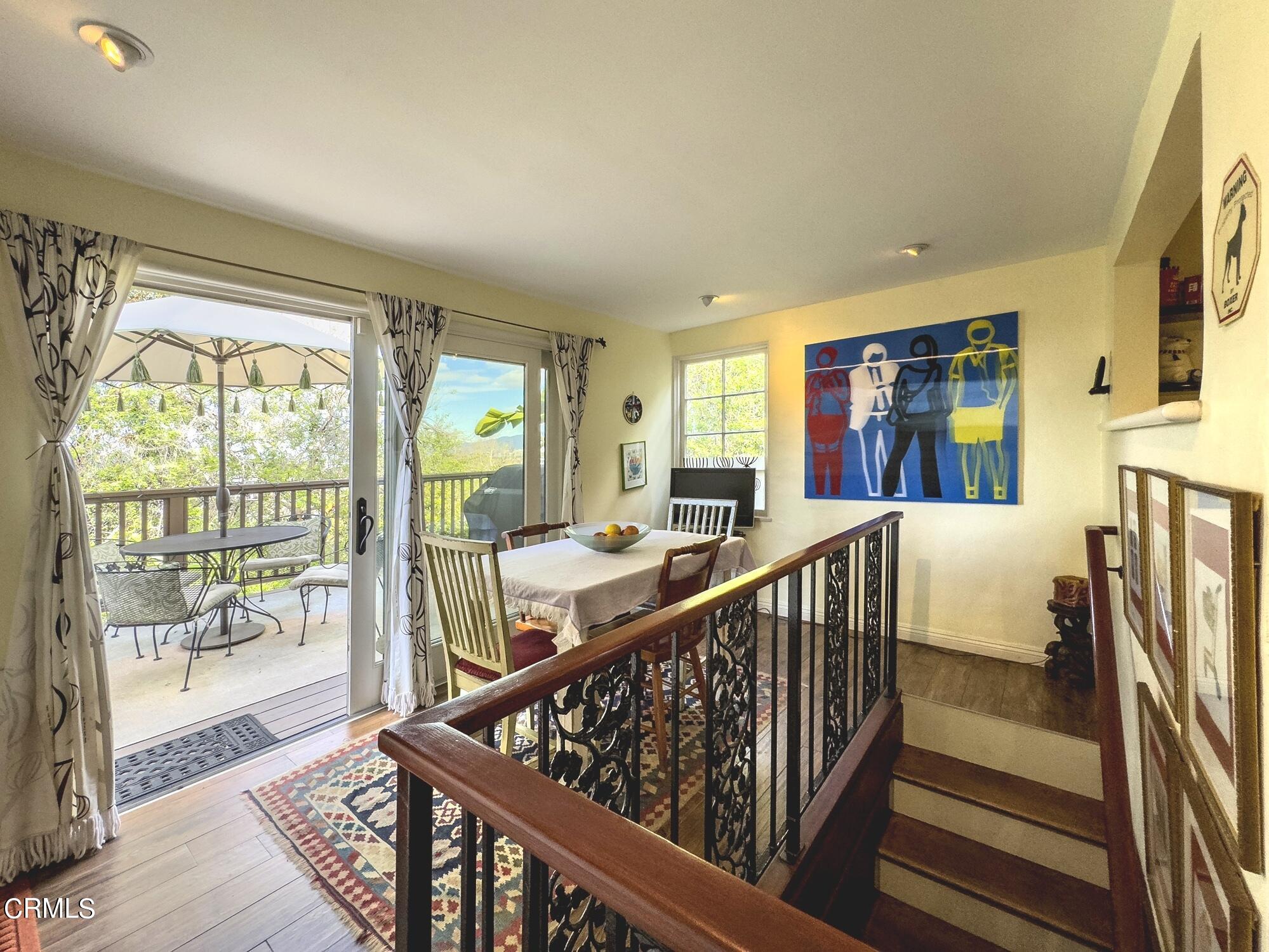 735 Prospect Drive Glendale, CA 91205 - Photo 17 of 49 a view of staircase with furniture and a floor to ceiling window