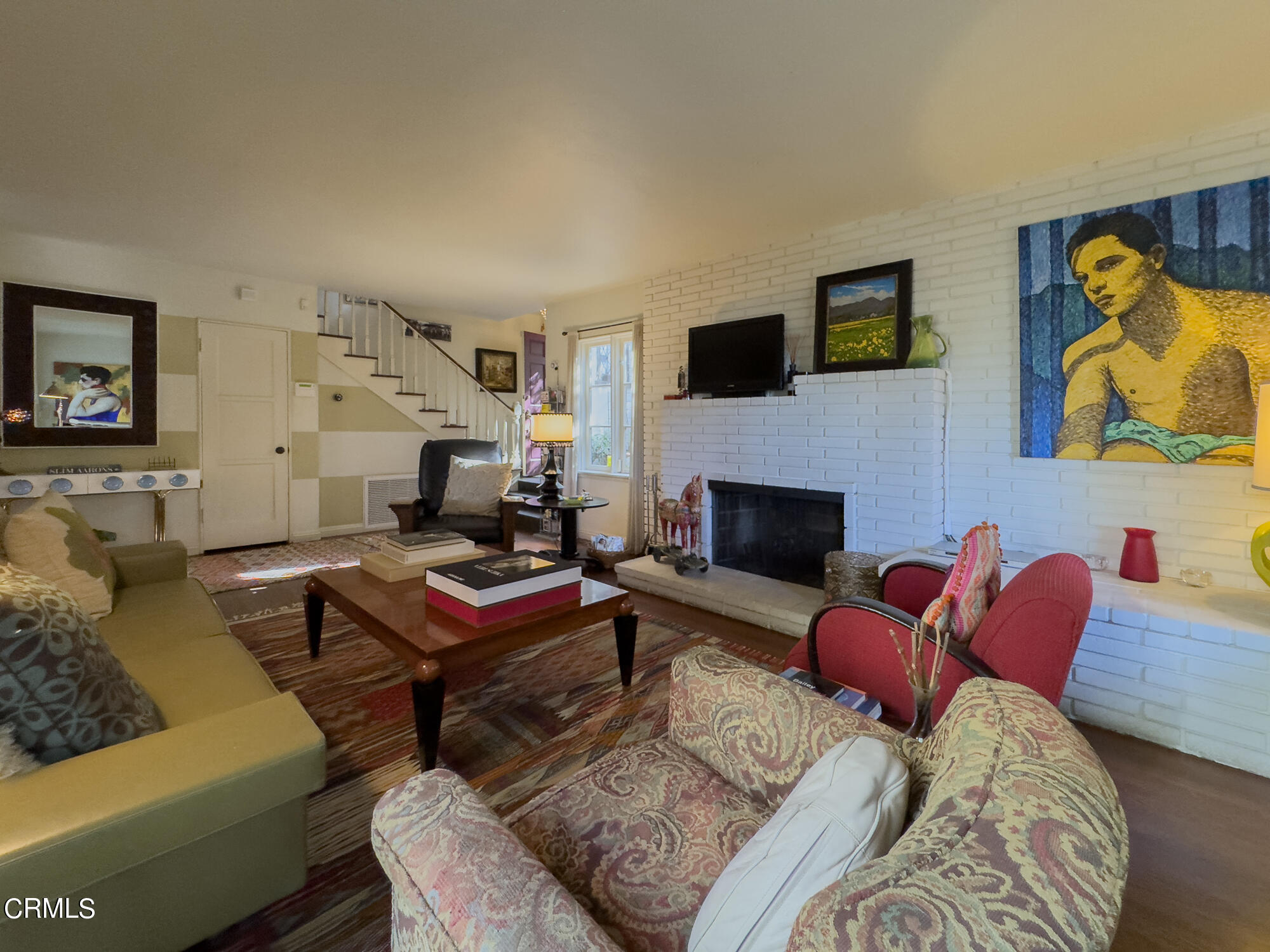 735 Prospect Drive Glendale, CA 91205 - Photo 7 of 49 a living room with furniture a flat screen tv and a fireplace