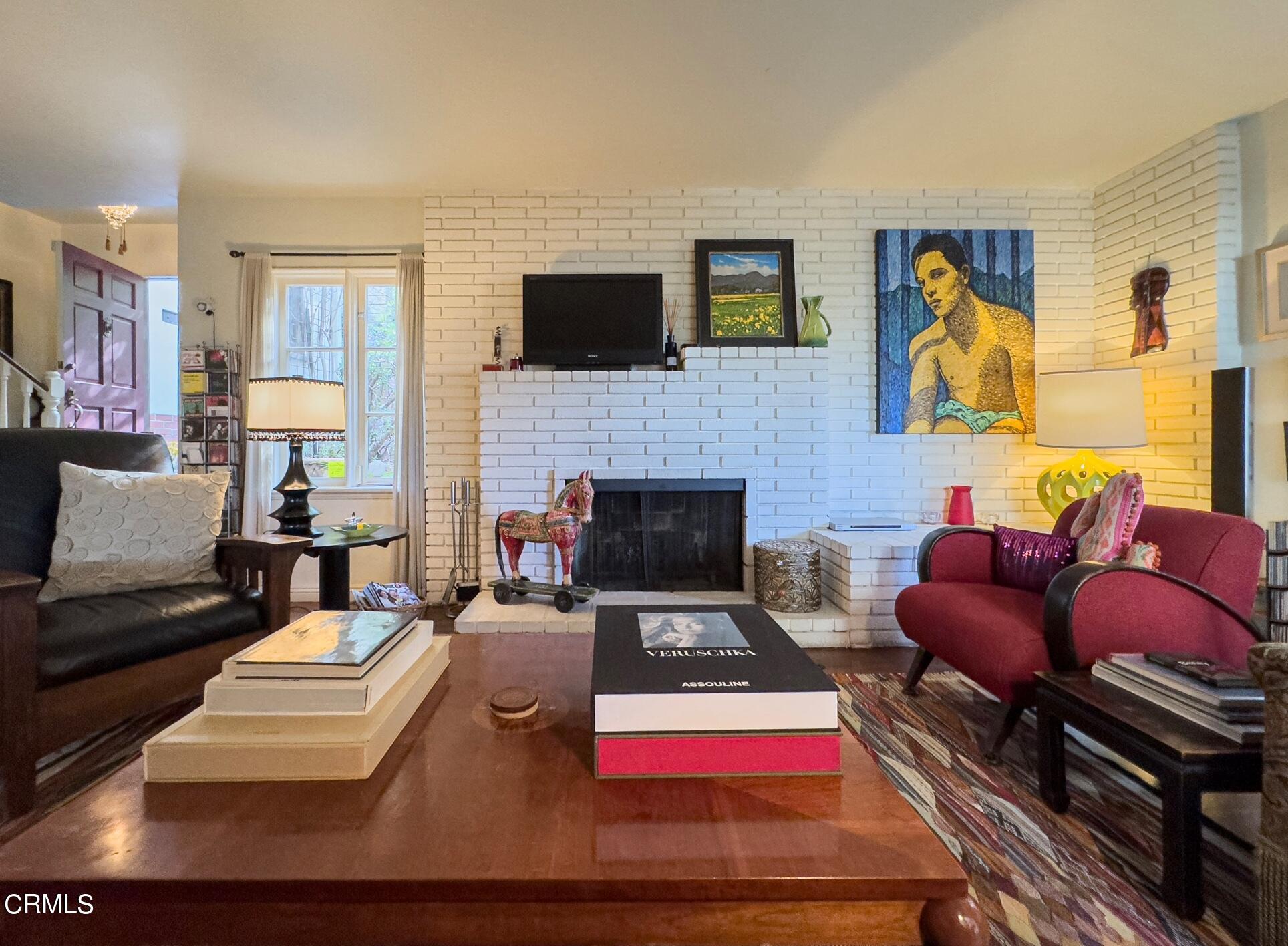 735 Prospect Drive Glendale, CA 91205 - Photo 8 of 49 a living room with furniture fireplace and flat screen tv