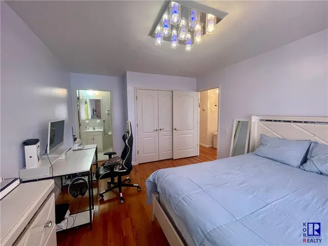 a room with furniture a lamp and a chandelier