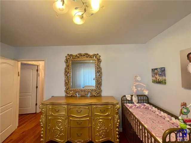 a spacious bedroom with a bed and a couch