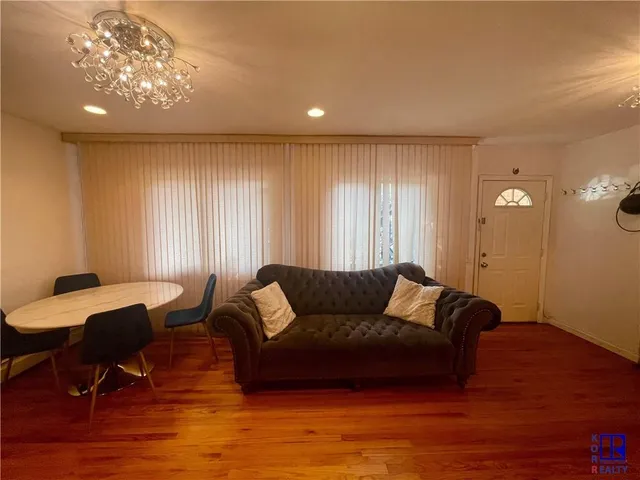 a kitchen with stainless steel appliances granite countertop a stove refrigerator sink and cabinets