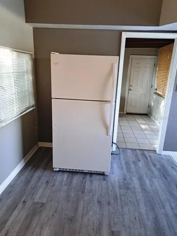 a view of kitchen with wooden floor