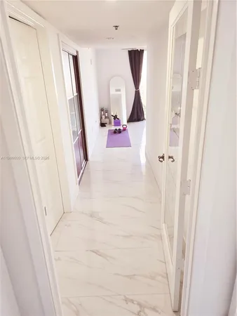 a bathroom with a sink and mirror with toilet
