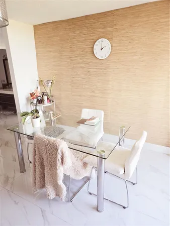 a view of a workspace with table and chairs