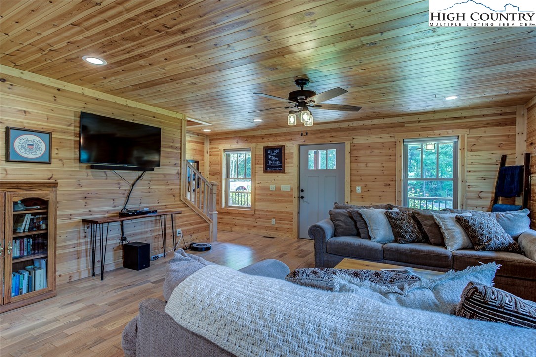 1210 Staghorn Road Purlear, NC 28665 - Photo 13 of 42 a living room with furniture and a flat screen tv