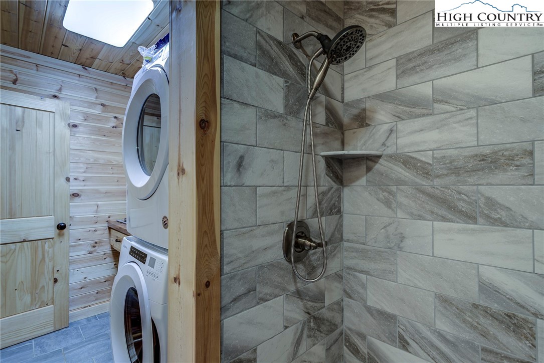 1210 Staghorn Road Purlear, NC 28665 - Photo 26 of 42 a bathroom with a washing machine and a shower