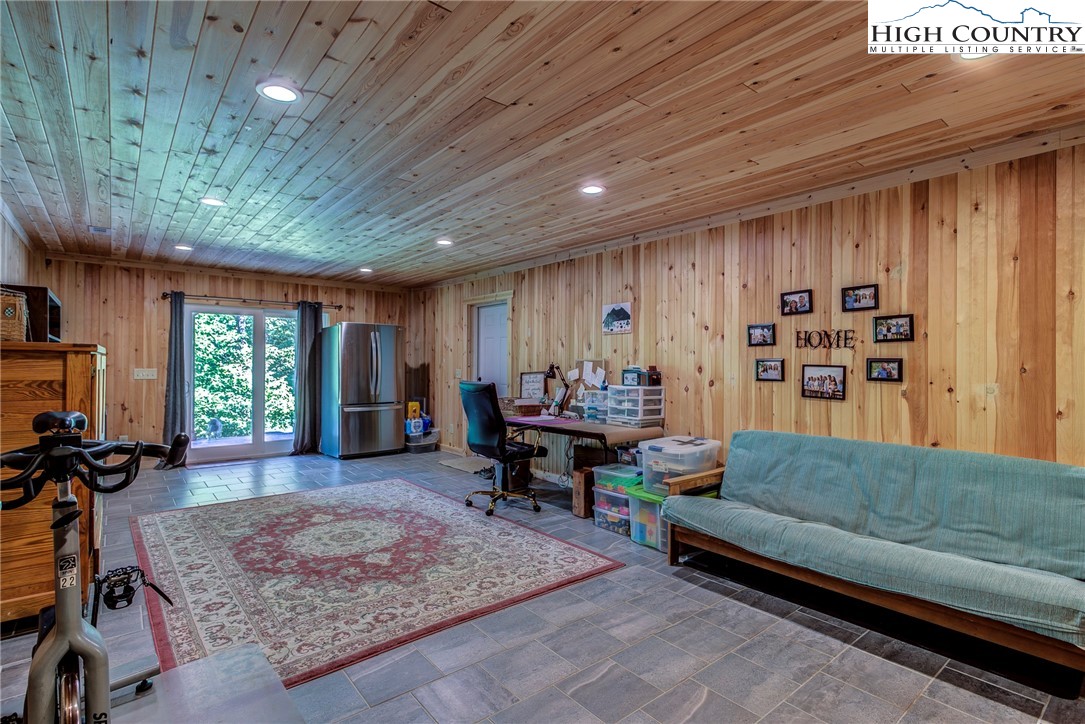 1210 Staghorn Road Purlear, NC 28665 - Photo 29 of 42 a living room with furniture and a large window
