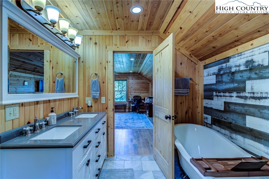 1210 Staghorn Road Purlear, NC 28665 - Photo 36 of 42 a kitchen with sink refrigerator and cabinets