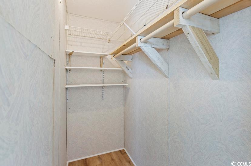 1030 Levi Street Manning, SC 29102 - Photo 24 of 31 Walk in closet featuring wood finished floors