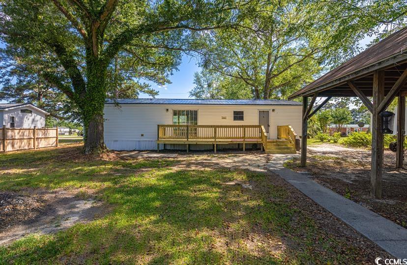 1030 Levi Street Manning, SC 29102 - Photo 5 of 31 Back of house featuring a wooden deck and metal roof