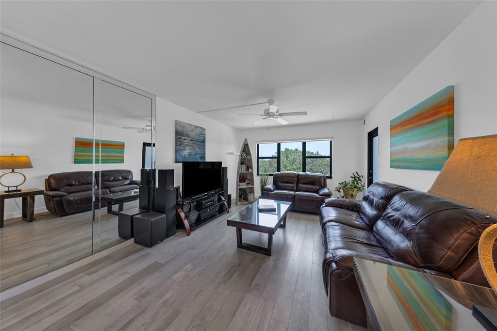 900 River Reach Drive, Unit 518 Fort Lauderdale, FL 33315 - Photo 12 of 47 a living room with furniture flat screen tv and hard wood flooring