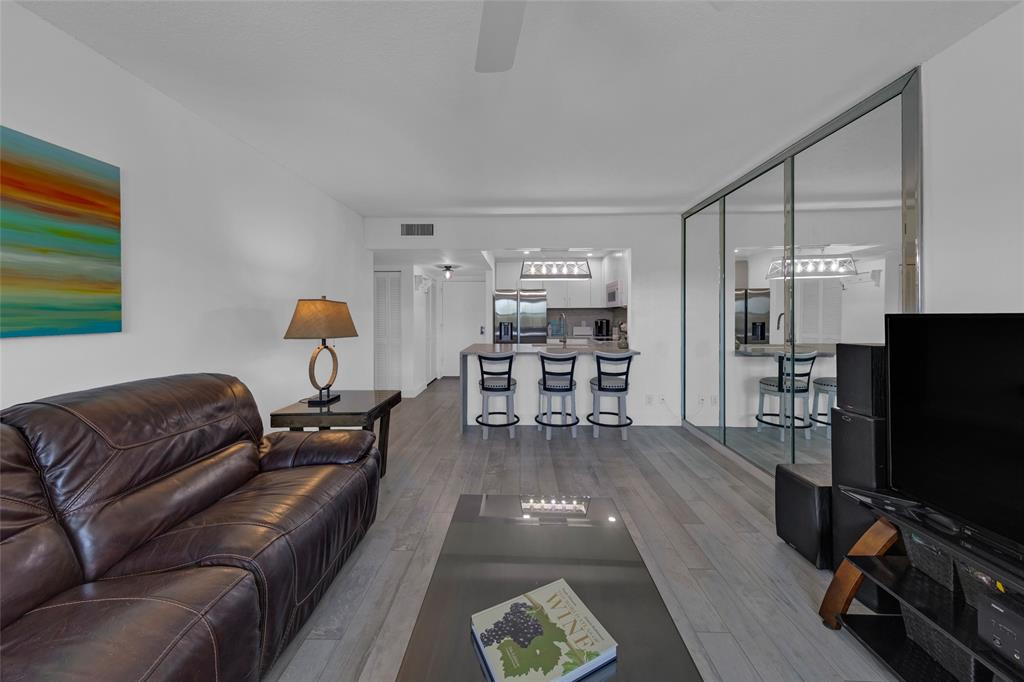 900 River Reach Drive, Unit 518 Fort Lauderdale, FL 33315 - Photo 13 of 47 a living room with furniture and a flat screen tv