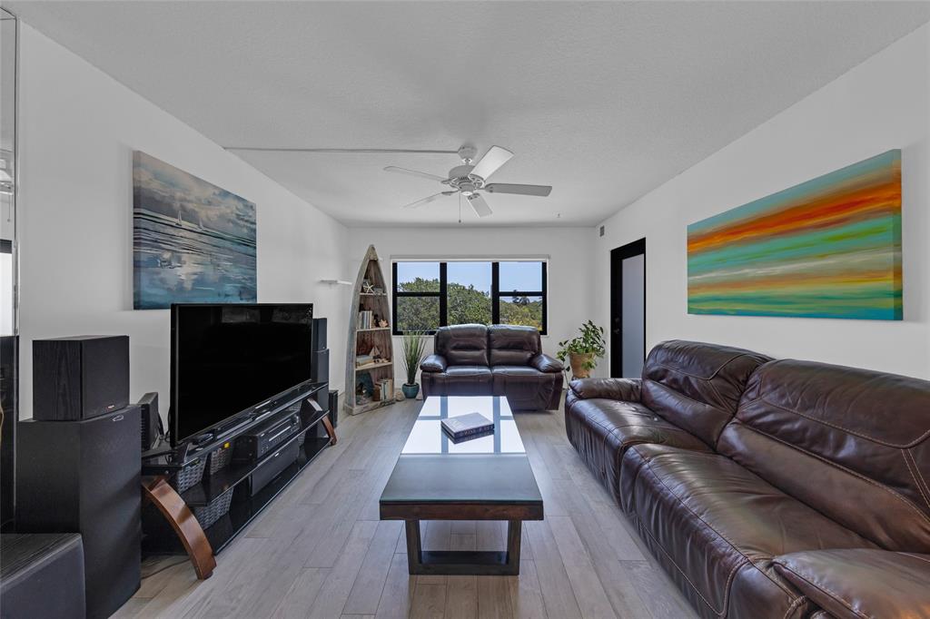 900 River Reach Drive, Unit 518 Fort Lauderdale, FL 33315 - Photo 14 of 47 a living room with furniture and a flat screen tv