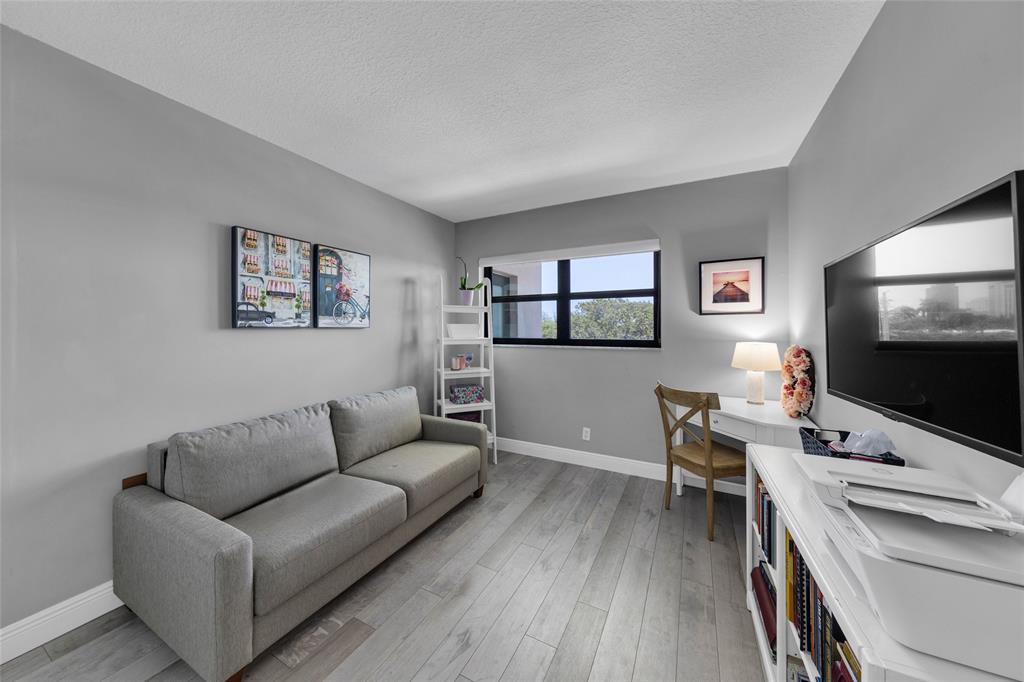 900 River Reach Drive, Unit 518 Fort Lauderdale, FL 33315 - Photo 21 of 47 a living room with furniture and a flat screen tv