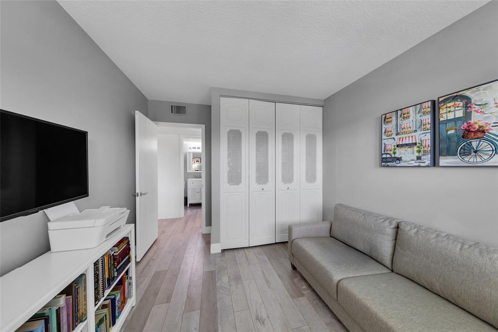 900 River Reach Drive, Unit 518 Fort Lauderdale, FL 33315 - Photo 22 of 47 a living room with furniture and a flat screen tv