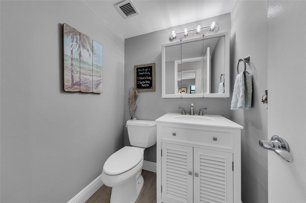 900 River Reach Drive, Unit 518 Fort Lauderdale, FL 33315 - Photo 23 of 47 a bathroom with a toilet sink and mirror