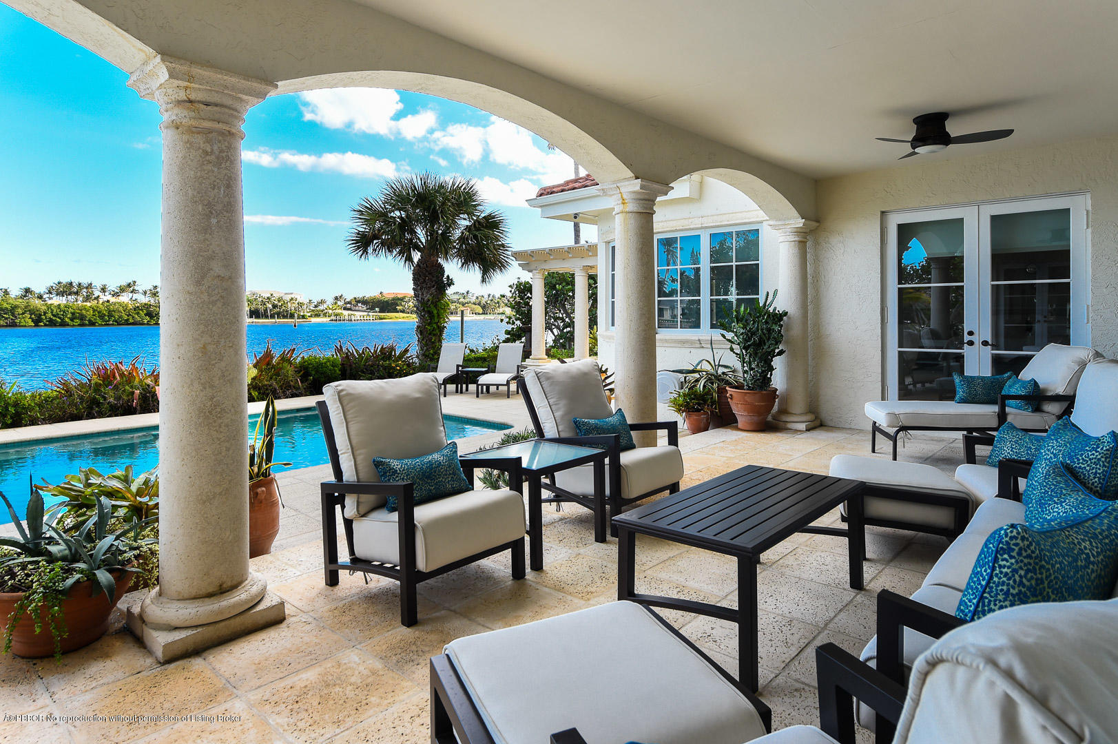 1620 Lands End Road Manalapan, FL 33462 - Photo 15 of 18 a view of a patio with couches and potted plants
