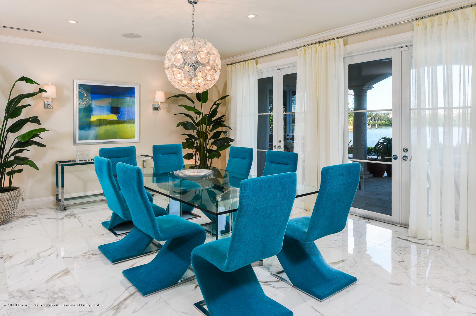 1620 Lands End Road Manalapan, FL 33462 - Photo 5 of 18 a view of a dining room with furniture a chandelier and wooden floor