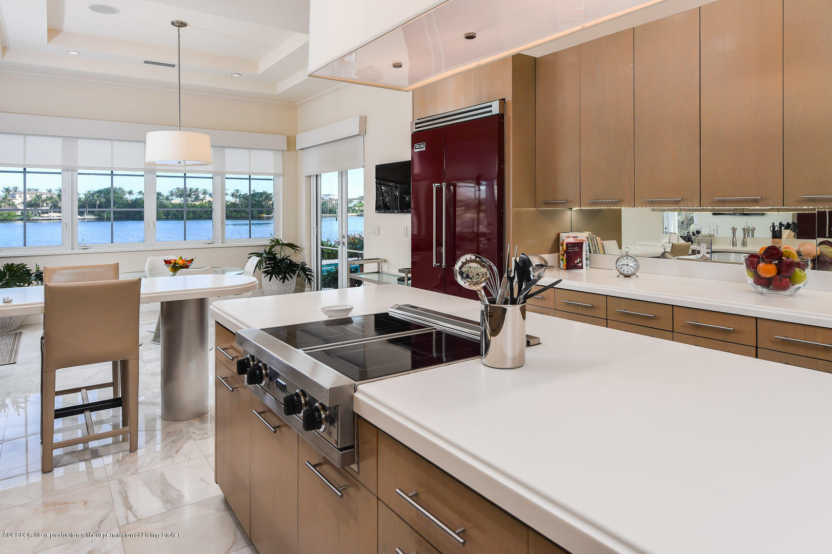 1620 Lands End Road Manalapan, FL 33462 - Photo 7 of 18 a kitchen with a sink a stove and chairs