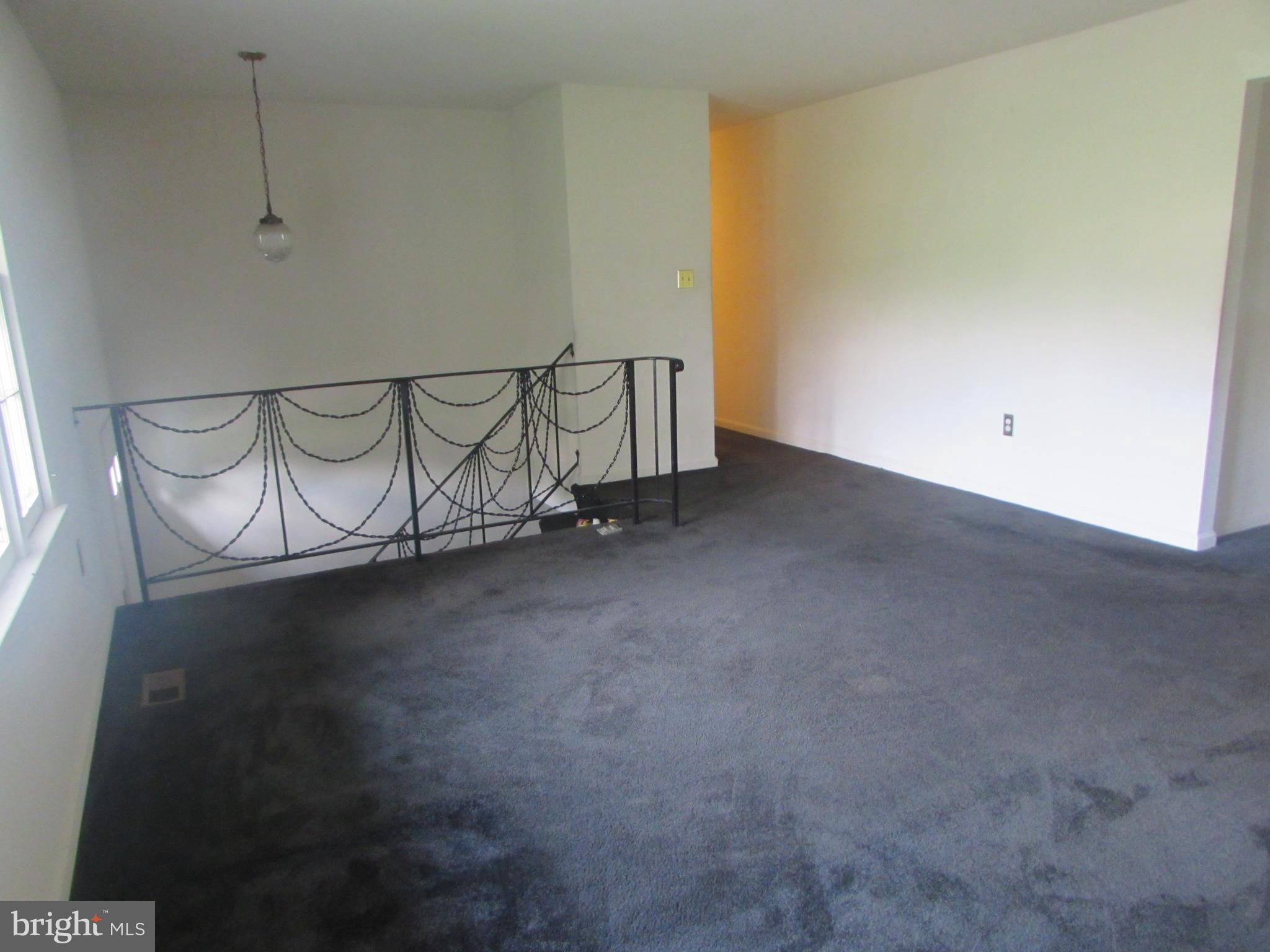 3507 Oaklawn Road Fort Washington, MD 20744 - Photo 3 of 16 a view of a room with racks on the wall