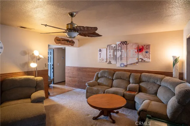 a bedroom with furniture and wooden floor