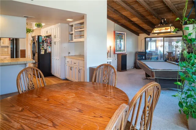 a kitchen with a white cabinets and sink