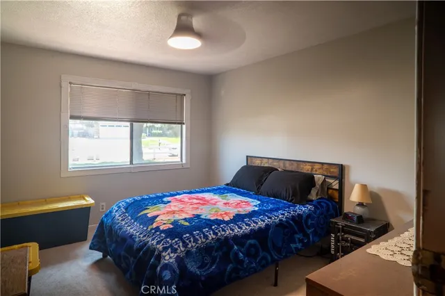 a white toilet sitting next to a small bathroom