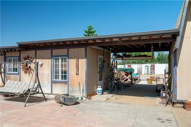 a view of backyard with a slide